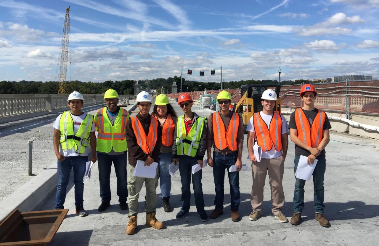 Highway engineers in group celebrating completion of highway project