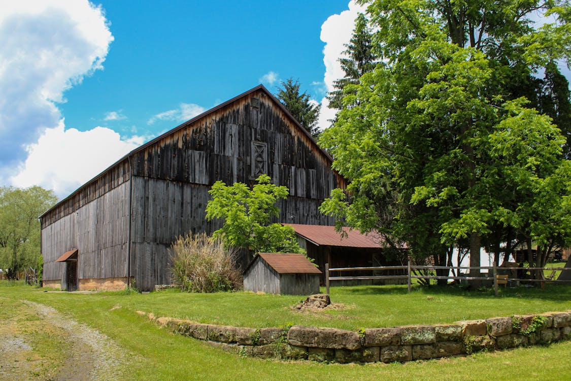 Historic barn with rustic landscape design