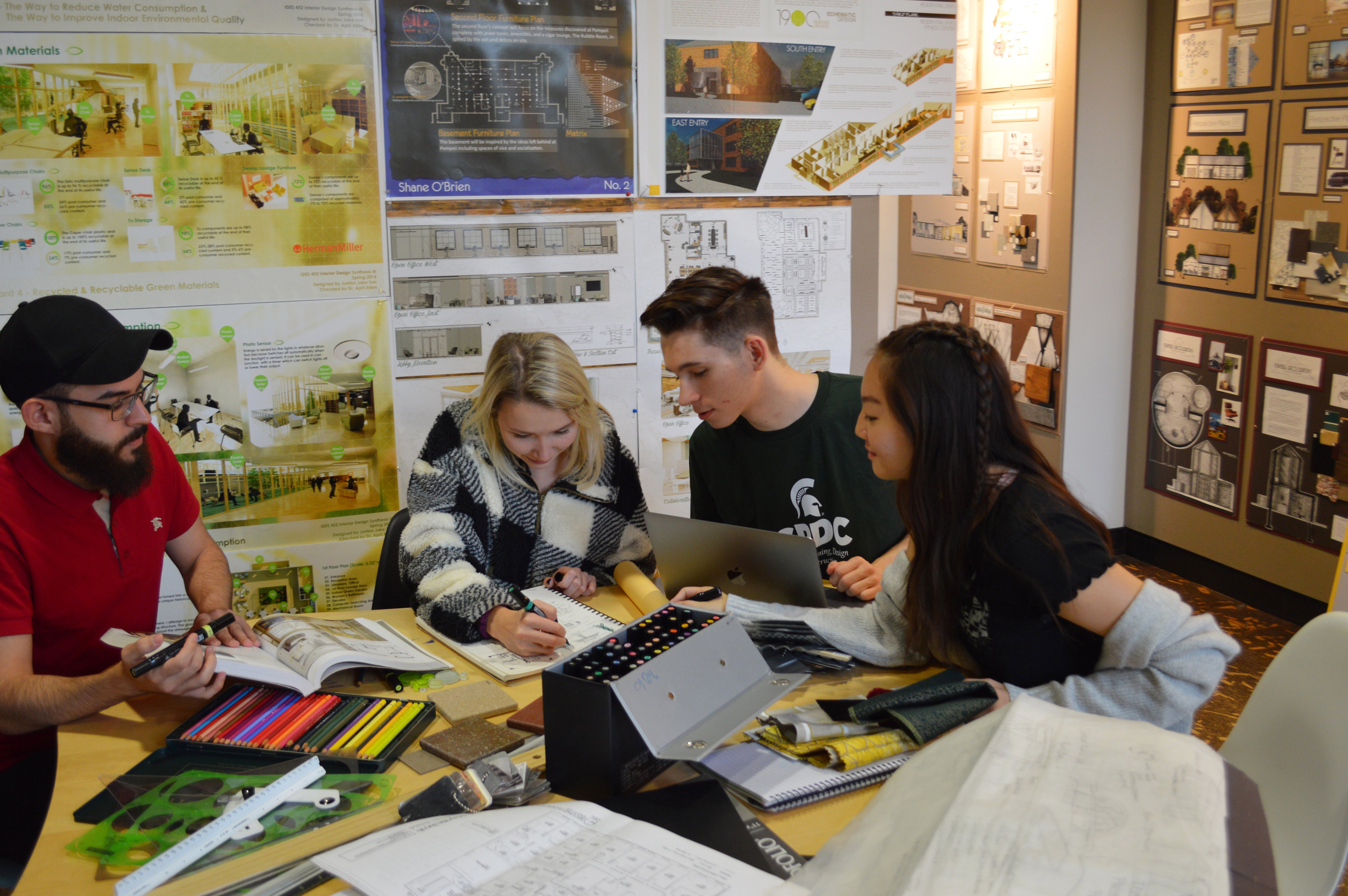 Interior design students collaborating on a project