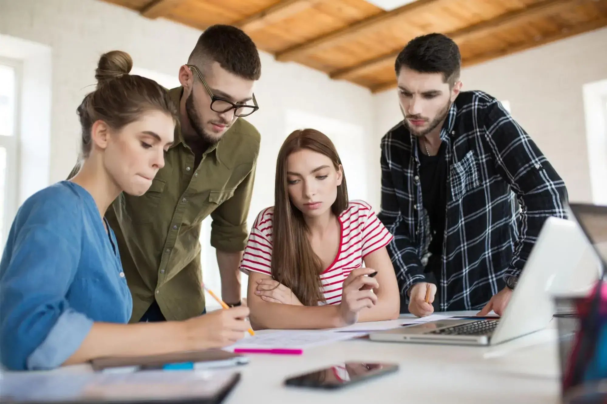 Interior design students discussing a project in class