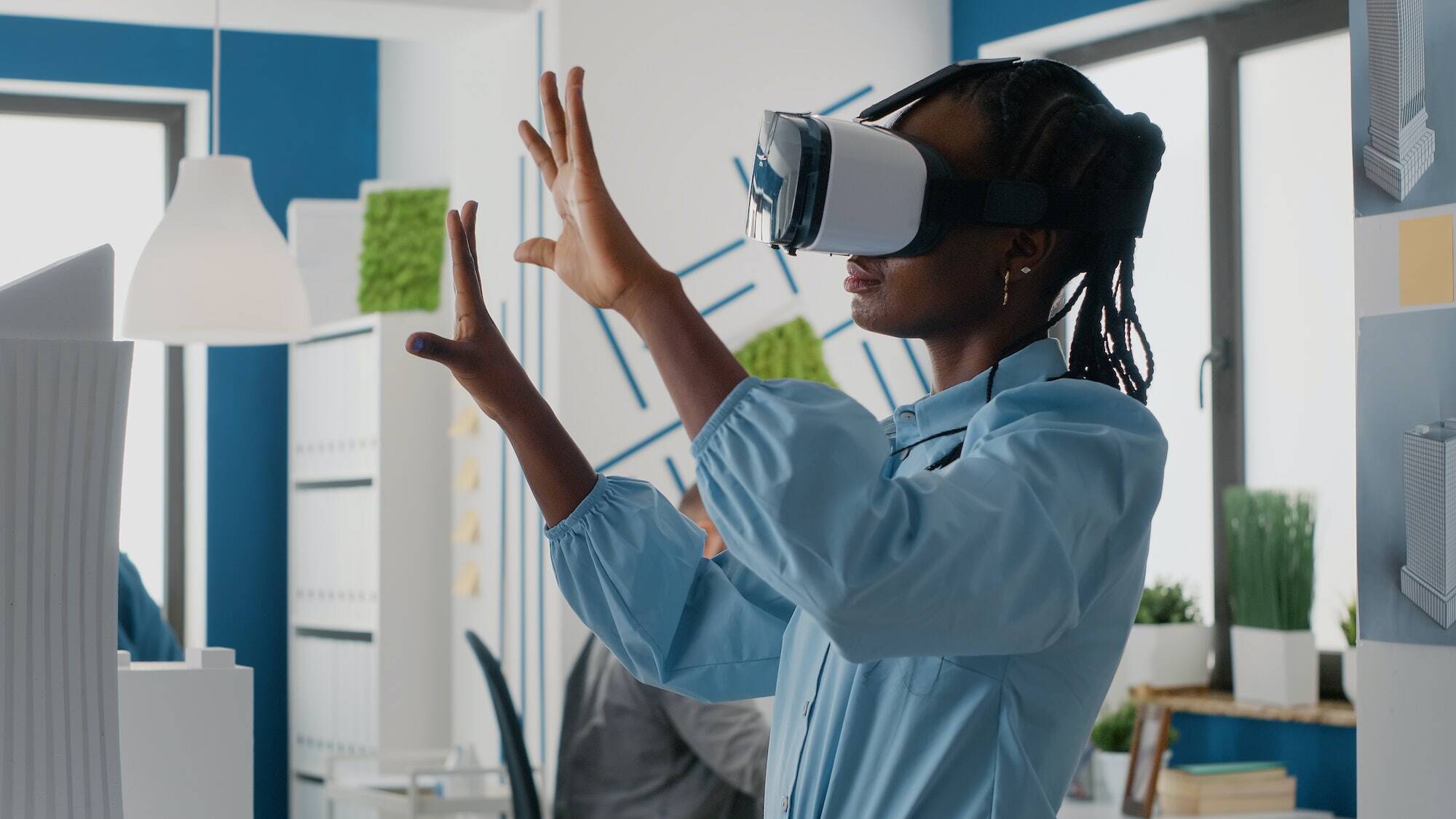 Interior designer working with VR glasses to design and visualise an upcoming project