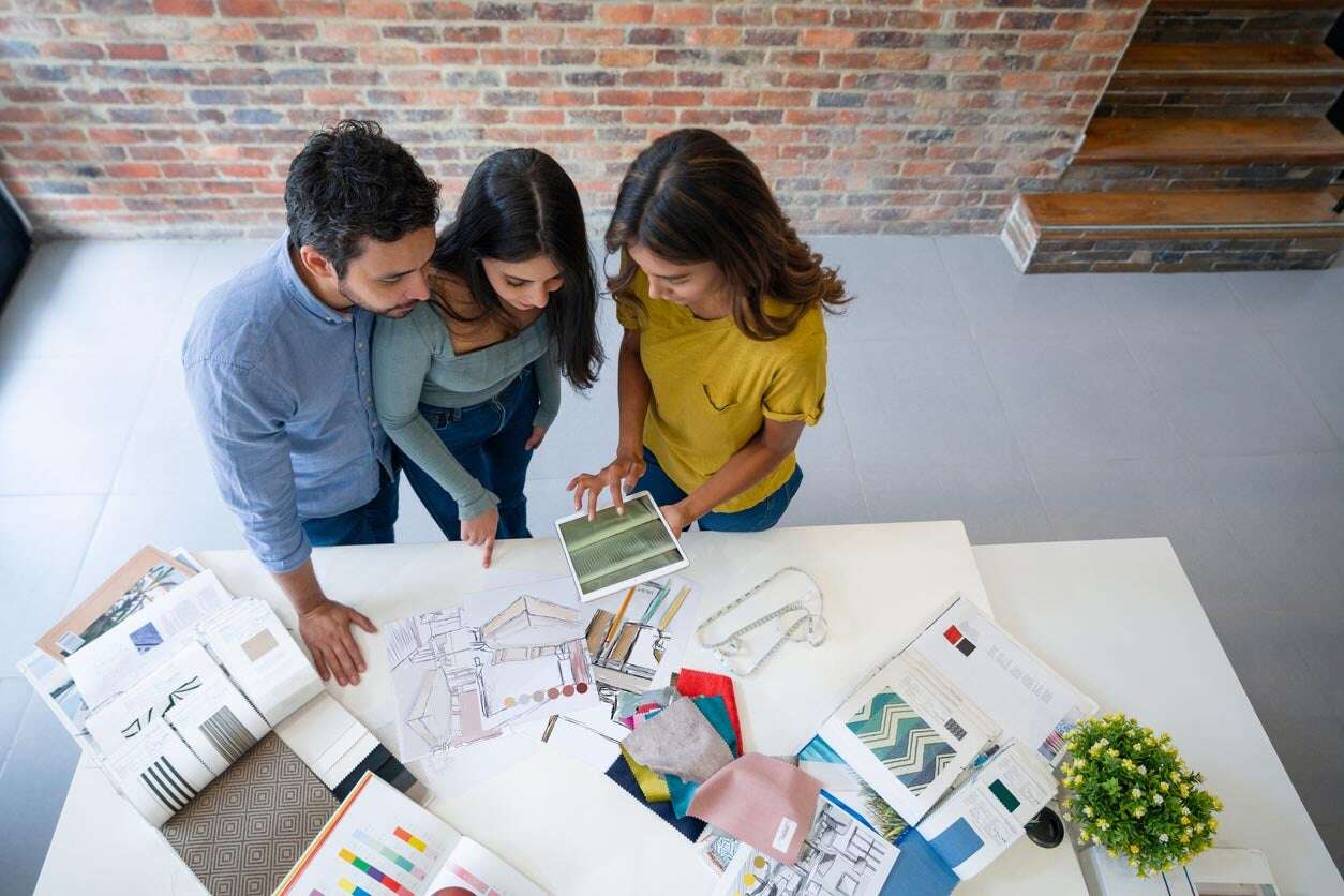 Interior designers discussing the material palette for a project