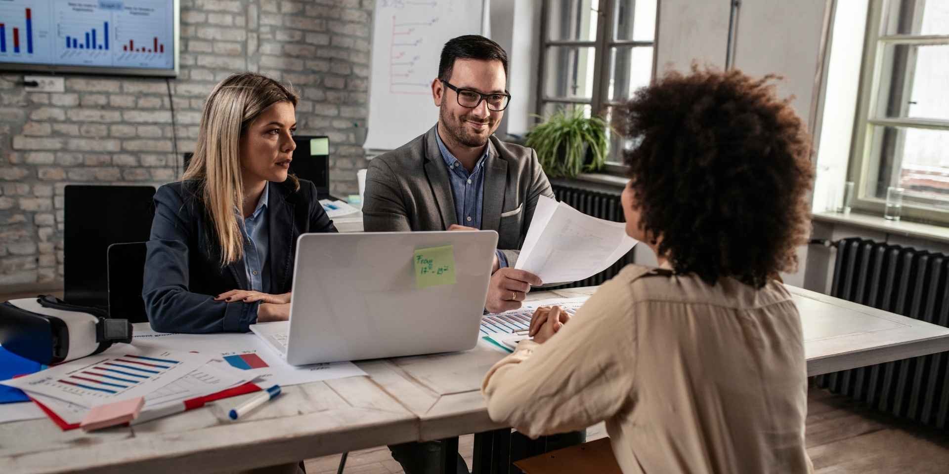 Job-seeking architectural historian discussing with employers
