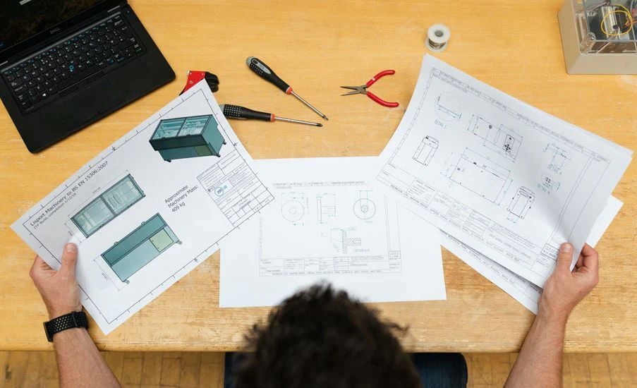 Licensed professional engineer approving engineering drawings and plans.