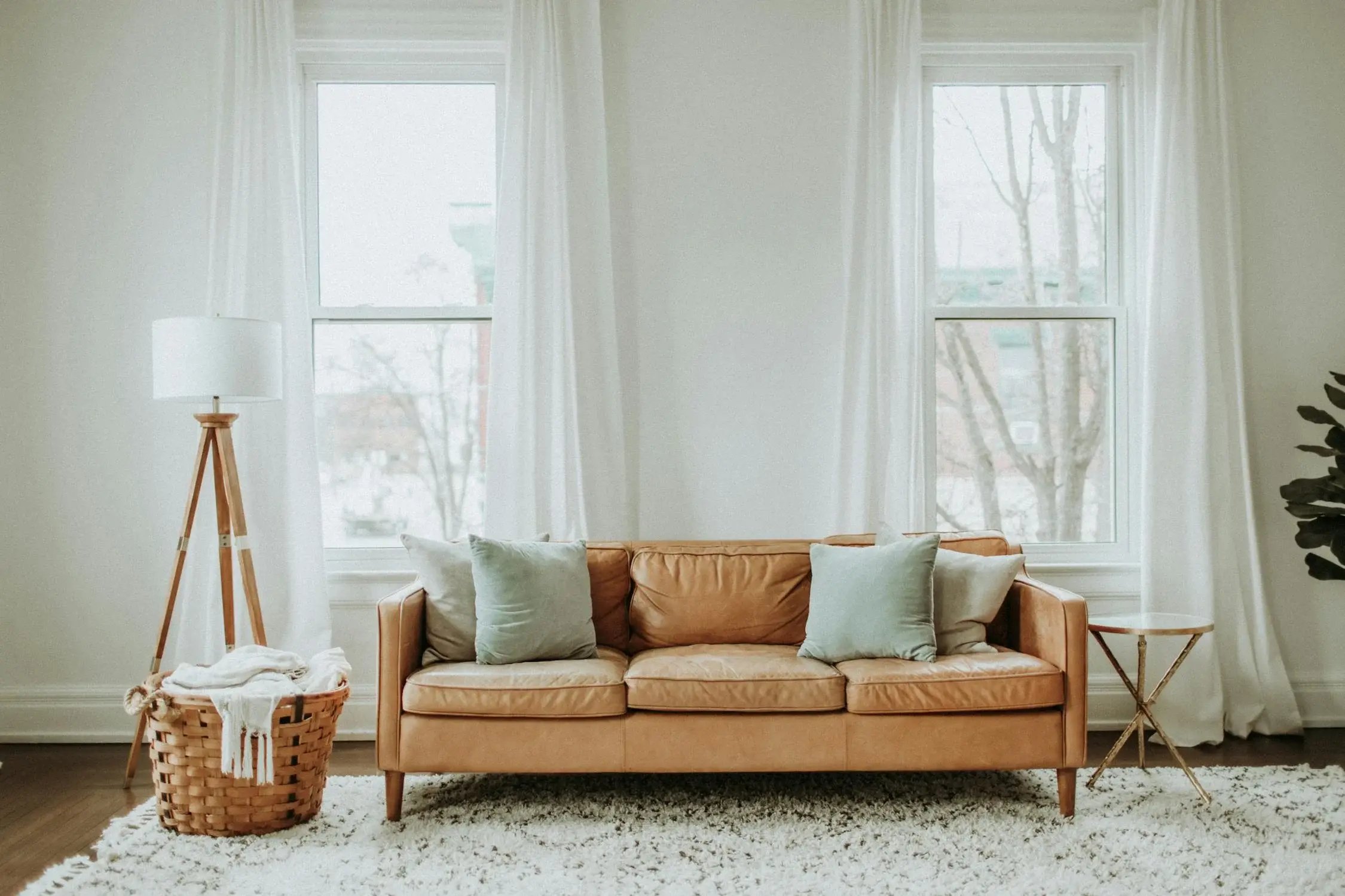 Living room interior with brown sofa chair and white curtain