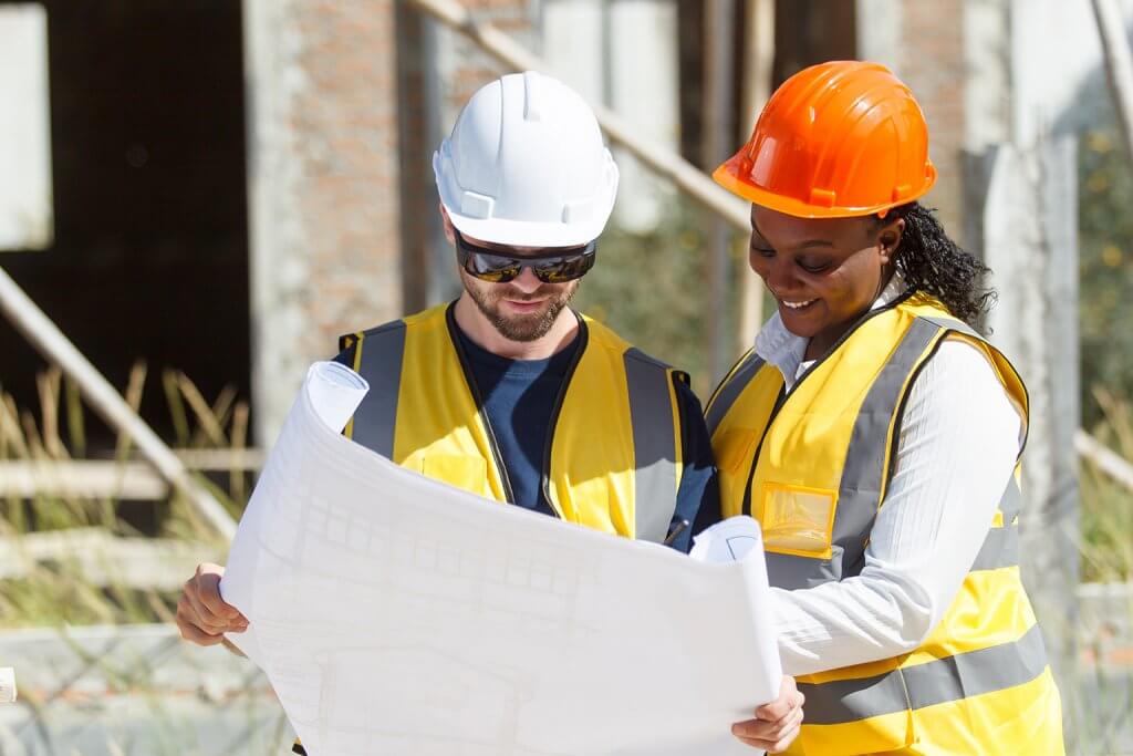 MEP contractors analysing a project draft for renovations