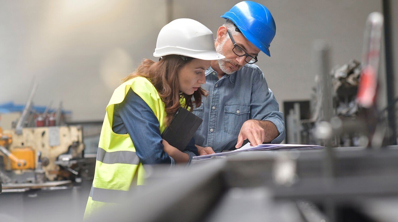 MEP engineers reviewing the architectural plan