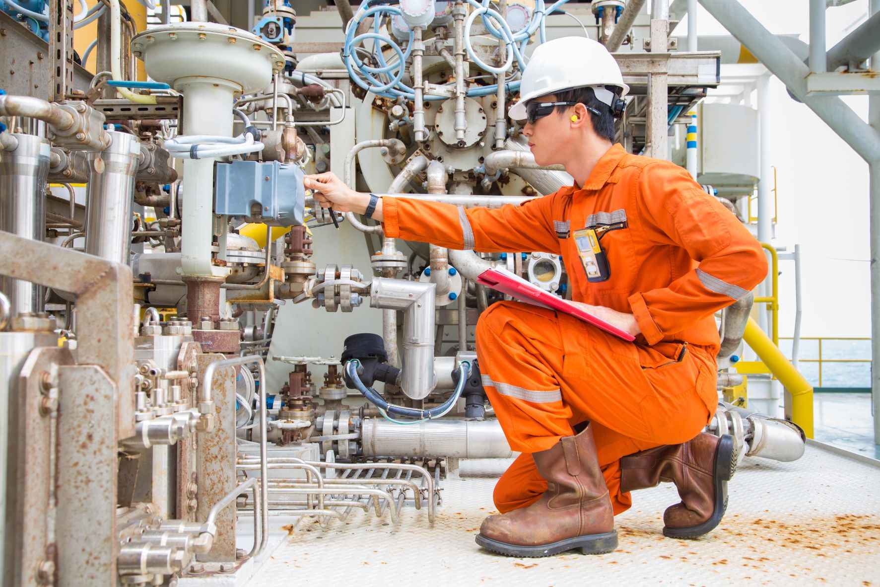 Mechanical engineer checking the machinery at the site