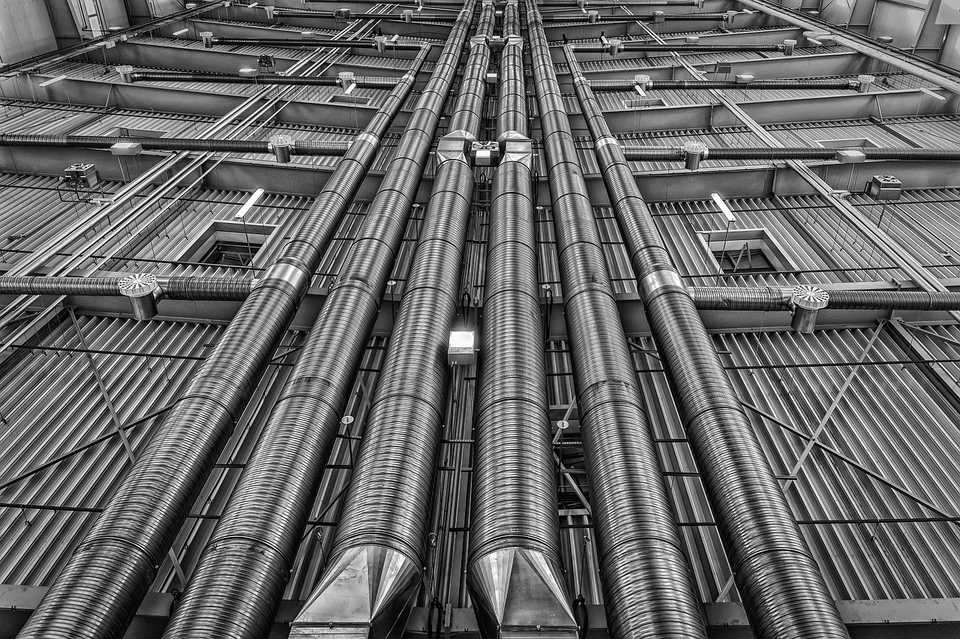 Metal ventilation pipes in HVAC system installation.