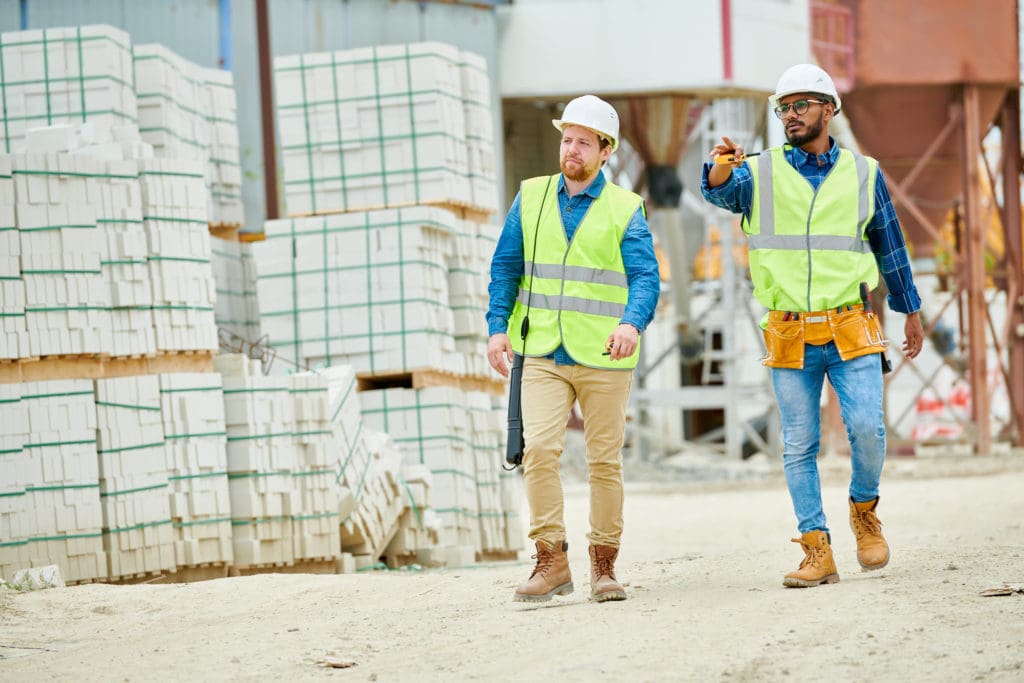 Professionals inspecting material procurement on site