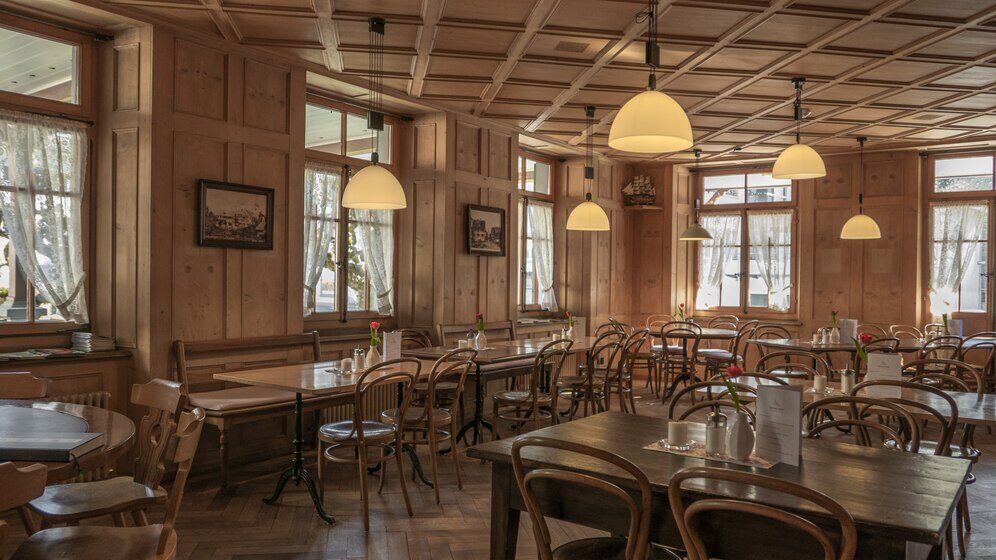 Restaurant setting with wooden chairs and tables