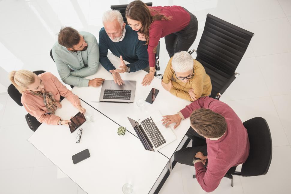 Senior civil engineers guiding upskilling professionals.