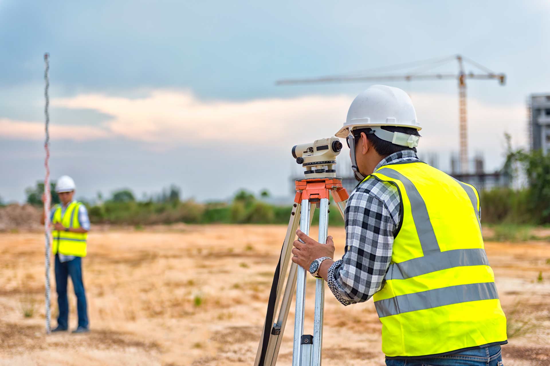 Site engineers surveying the construction site