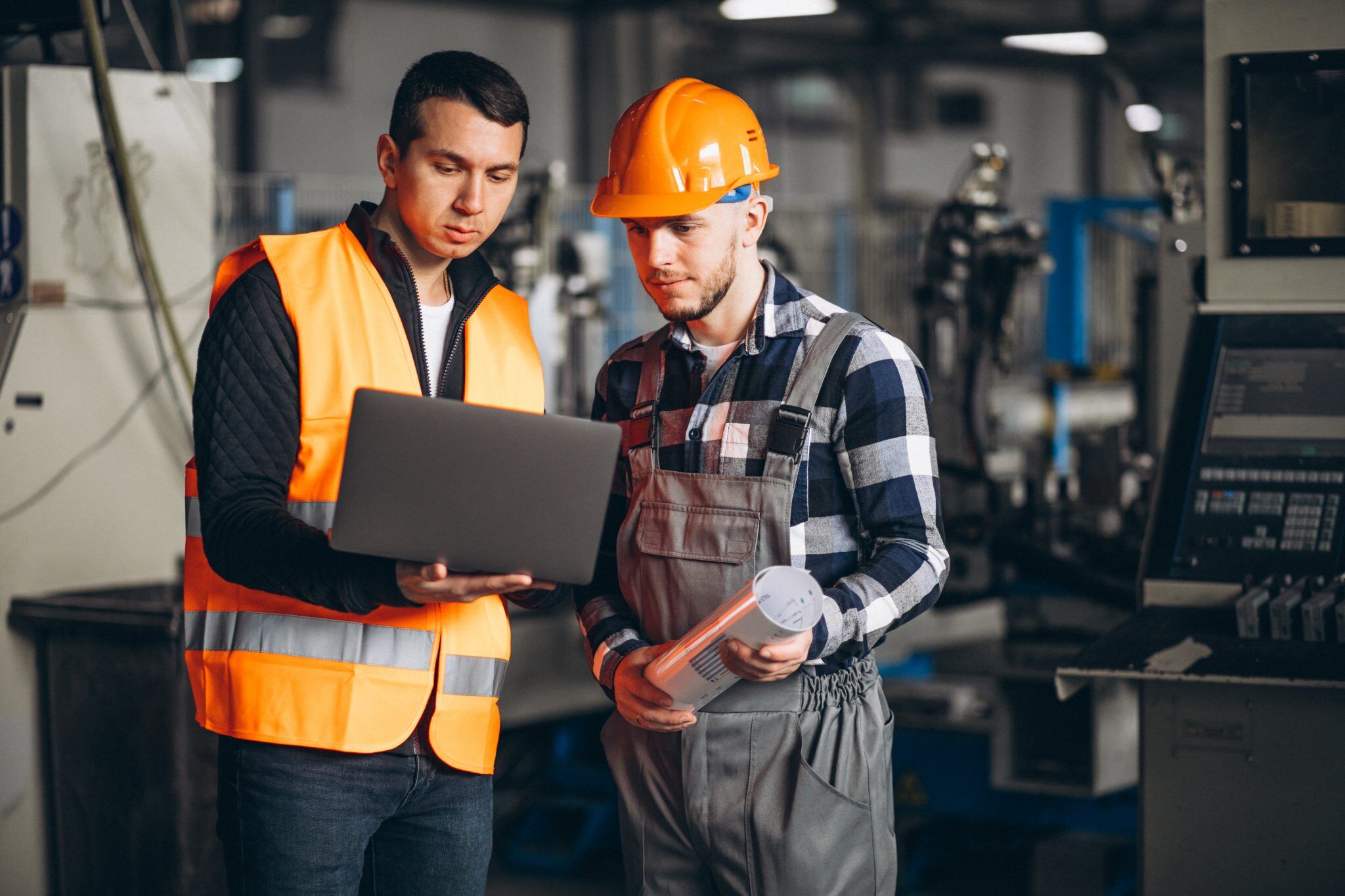 Two MEP engineers discussing the plan