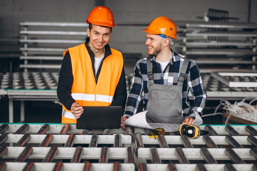 Two MEP engineers working at a factory