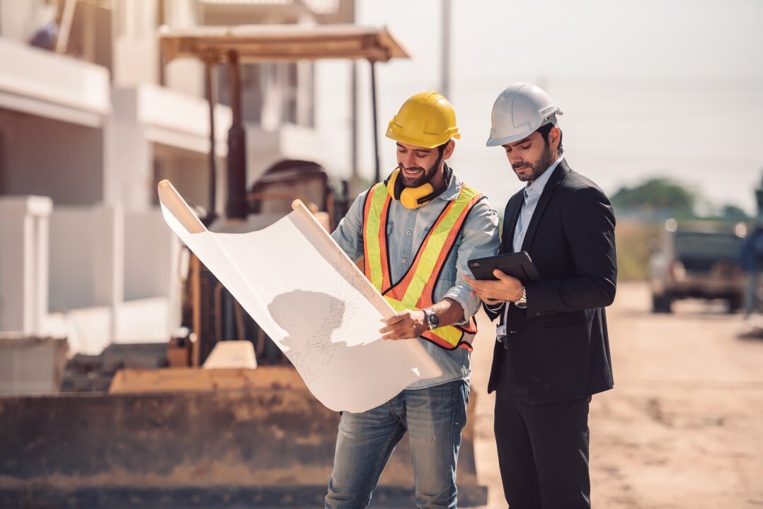 Two architects working at a construction site