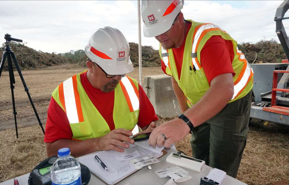 Two civil engineers discussing over the construction site in Nashville.