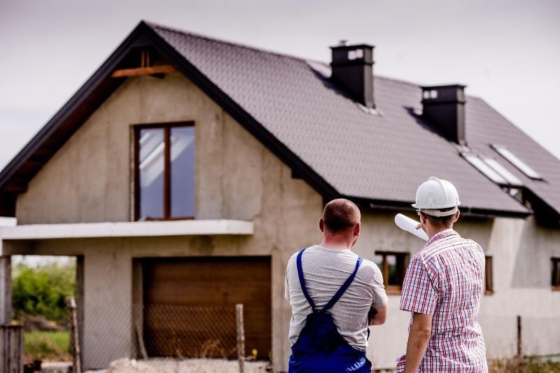 Two quantity surveyors checking site progress