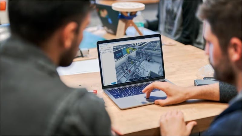 Upskilling quantity surveyors learning digital construction and BIM software.