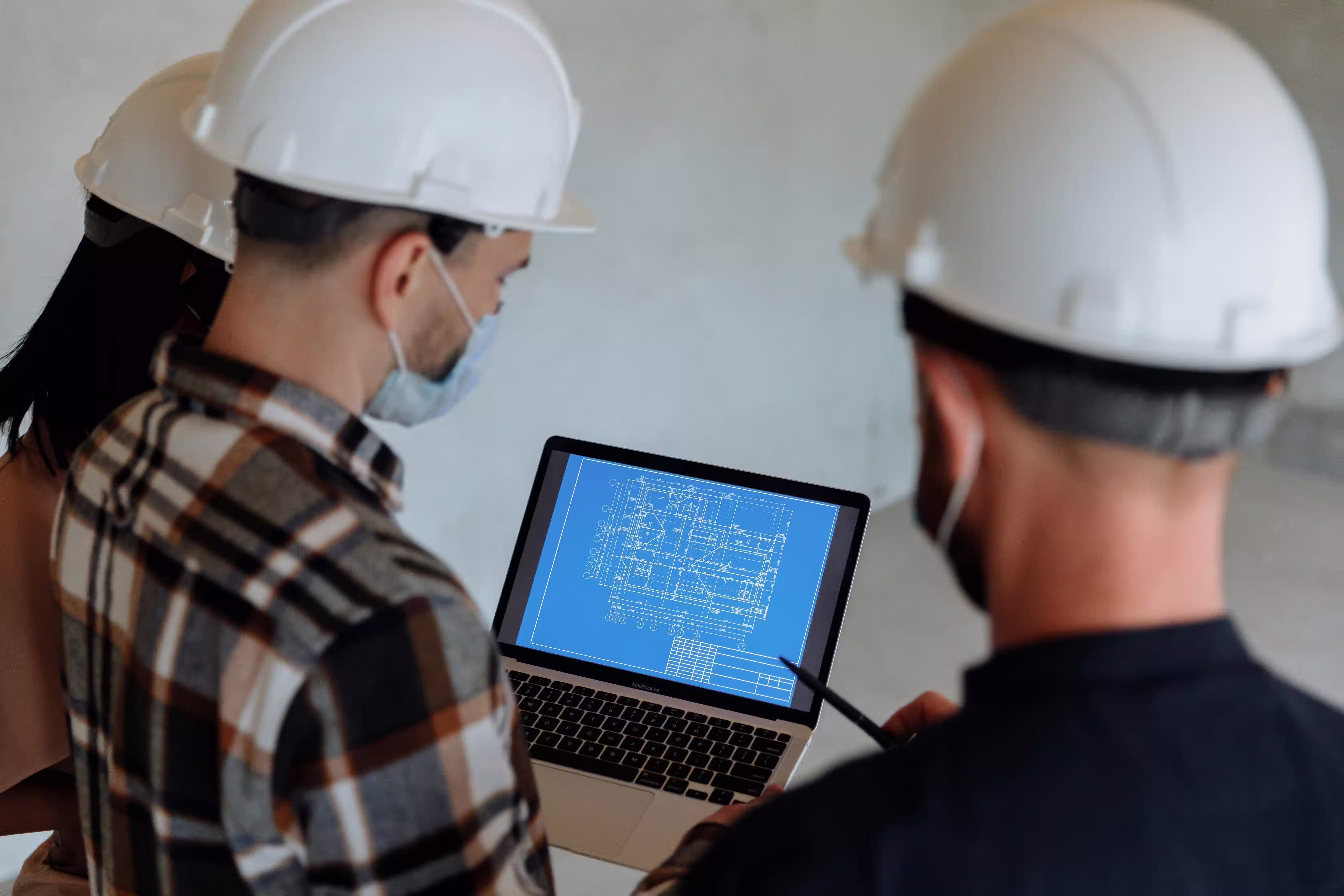 Urban planners analyzing a blueprint on site