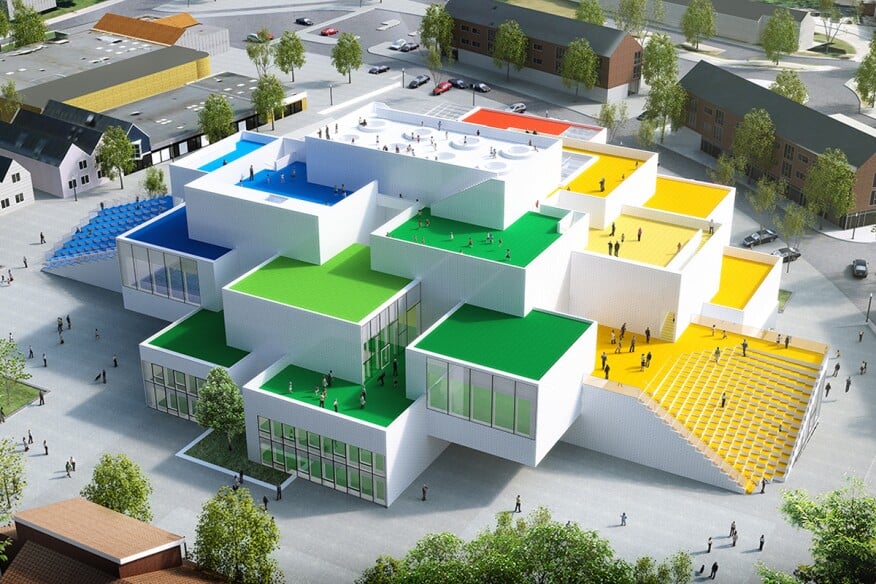 an image of a physical model of the Lego House with its immediate surrounding